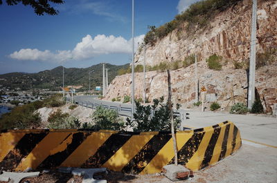 Scenic view of yellow by river against sky