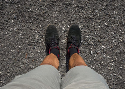 Low section of woman standing on ground