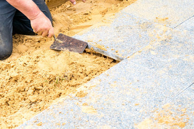 Midsection of person working on cutting board