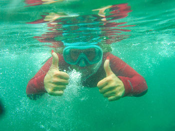 Boy swimming in pool