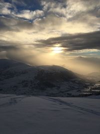 Scenic view of mountains against sky during winter