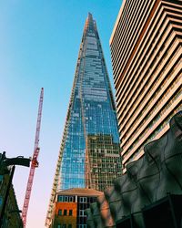 Low angle view of modern buildings against clear sky