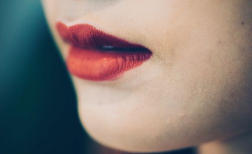 Cropped image of woman with red lipstick