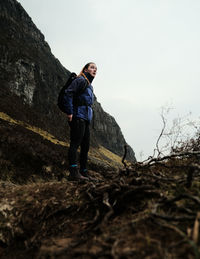 Rear view of man standing on mountain