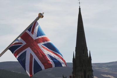 Low angle view of flag against sky