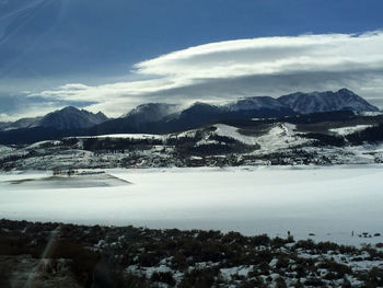 Scenic view of mountains against sky during winter