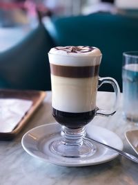 Close-up of coffee cup on table