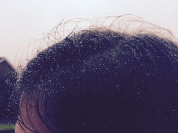 Close-up of woman against sky