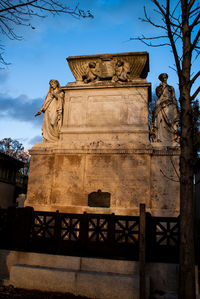 Low angle view of statue against sky