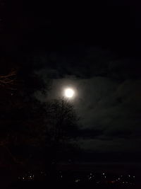 Low angle view of moon in sky at night