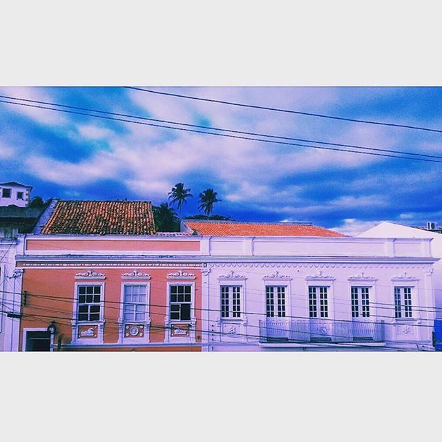 architecture, building exterior, built structure, sky, window, low angle view, house, cloud - sky, power line, residential building, residential structure, cloud, building, day, auto post production filter, cloudy, outdoors, no people, cable, facade