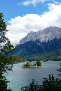 Scenic view of lake and mountains against sky