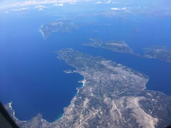 Aerial view of sea against blue sky