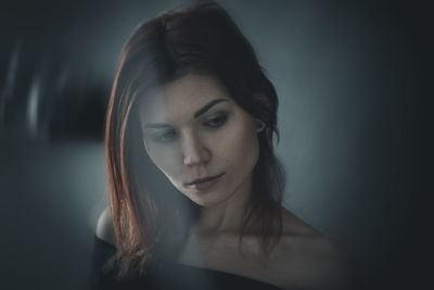 Close-up of young woman looking away