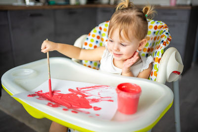 Close-up of cute girl playing with toy