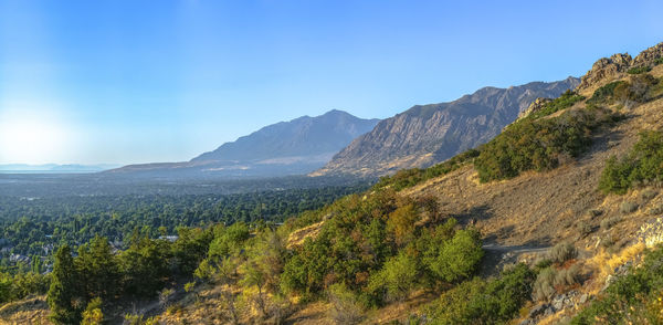 Scenic view of mountains against clear blue sky