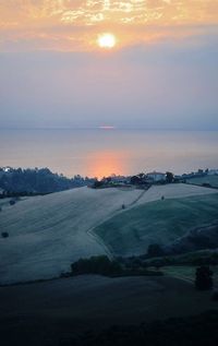 Scenic view of landscape against sky during sunset