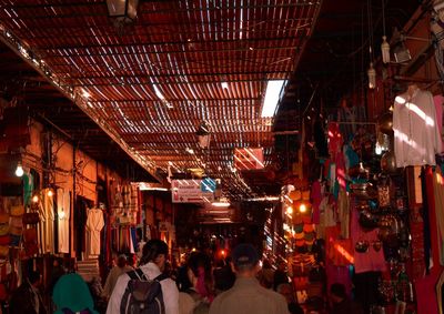 People at market stall at night