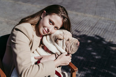 Full length of woman with dog