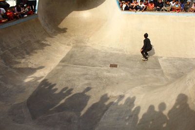 High angle view of man skateboarding in city