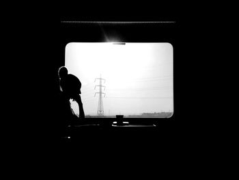 Blurred motion of woman in dark