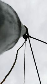 Low angle view of rope against sky