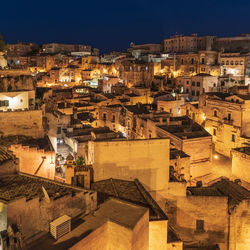 High angle view of old buildings in city at night