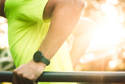 Midsection of man exercising in gym