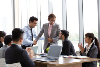 Group of people working on table