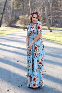 Smiling woman standing on road