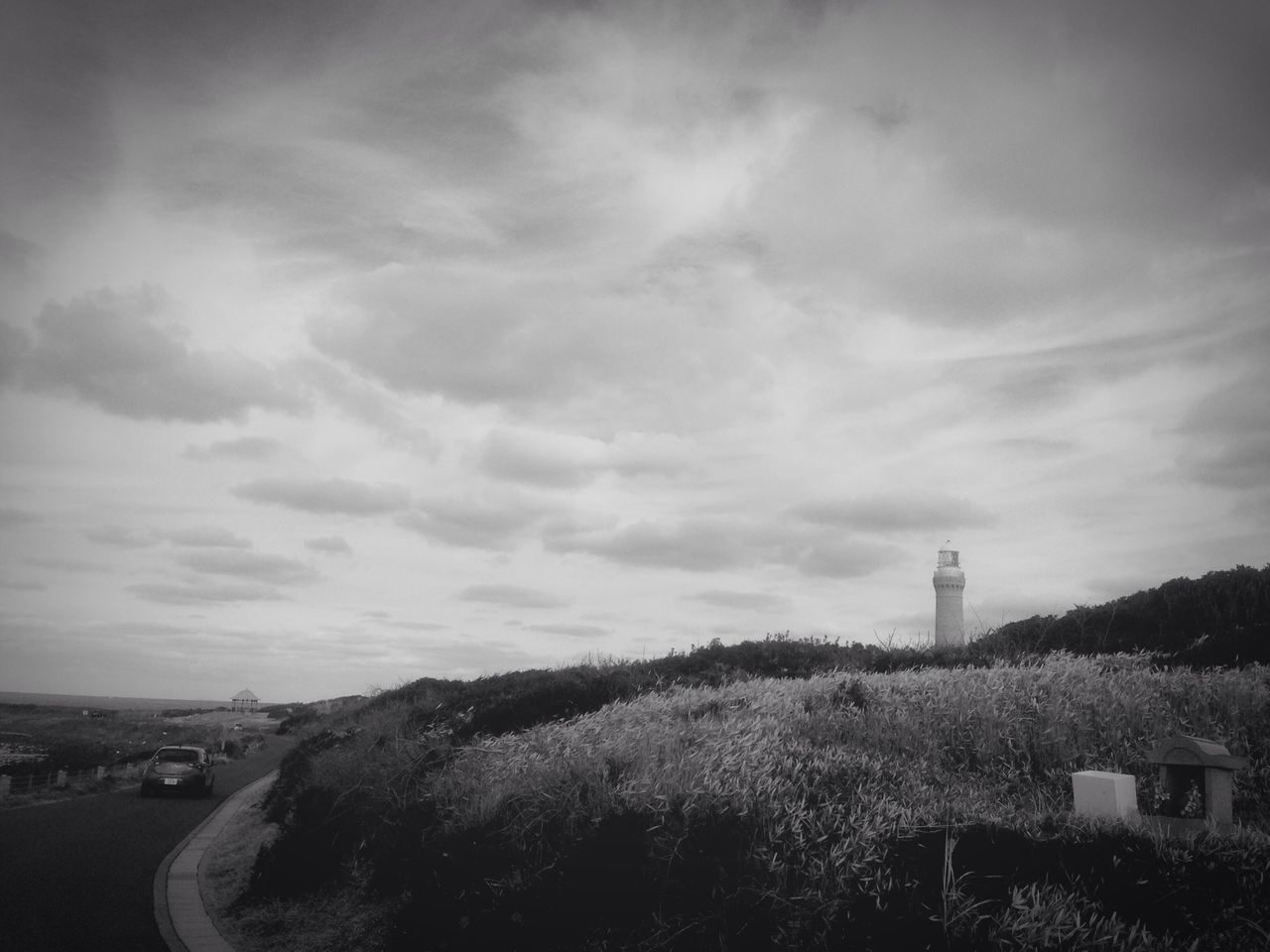 sky, cloud - sky, built structure, landscape, architecture, building exterior, cloudy, cloud, field, nature, tranquility, tranquil scene, scenics, tree, beauty in nature, road, day, outdoors, hill, guidance