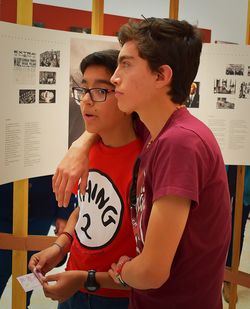 Brothers standing in museum