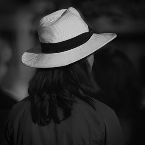 Rear view of woman wearing hat