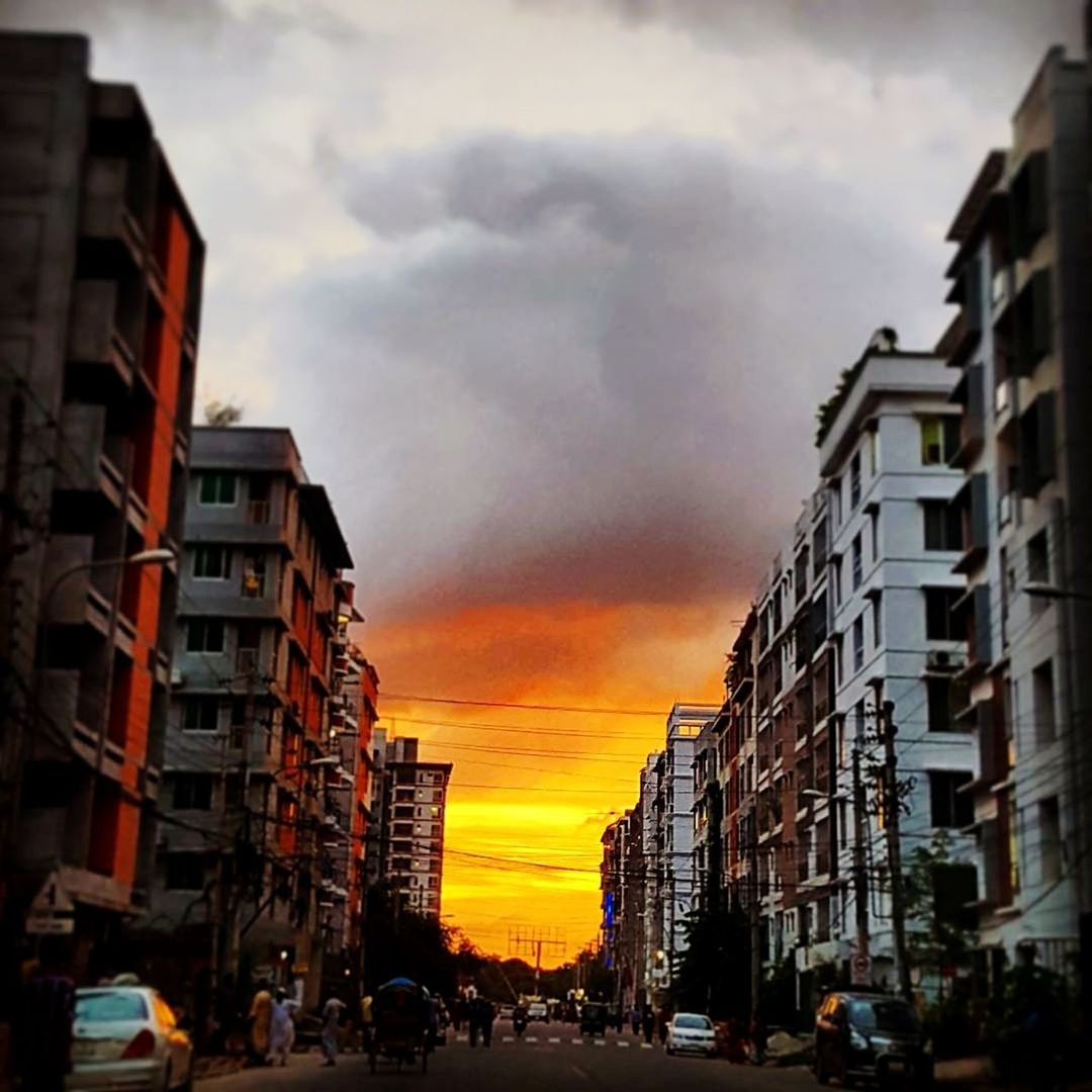 CITY STREET AGAINST SKY