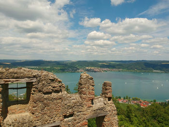 Panoramic view of sea and buildings against sky