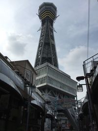 Low angle view of built structure against cloudy sky