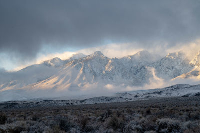 Scenic view of snowcapped mountains against sky