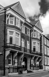 Houses against sky in city