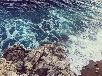 High angle view of sea and rocks