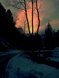 Scenic view of lake at sunset