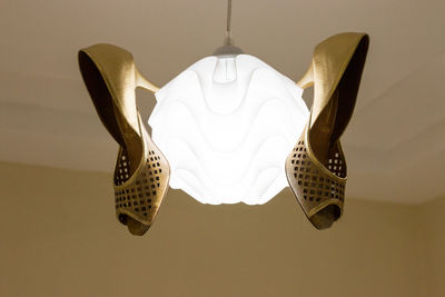 Low angle view of clothes hanging over white background