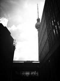 Low angle view of building against cloudy sky