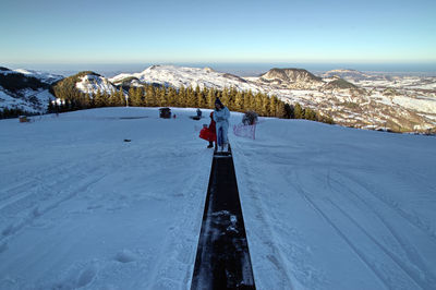 Scenic view of snow covered mountain against sky