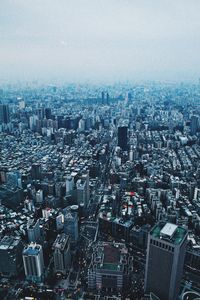 High angle view of illuminated cityscape against sky