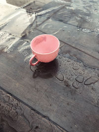 High angle view of red shoe on wood in city