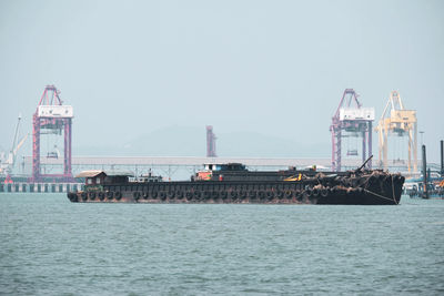 Pier over sea against clear sky