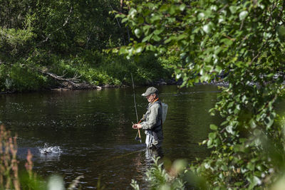 Man fishing in river