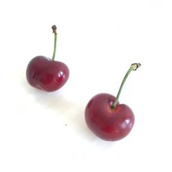 Close-up of red fruit on white background