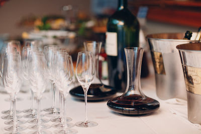 Close-up of wine glasses on table