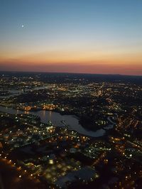 Aerial view of city lit up at night